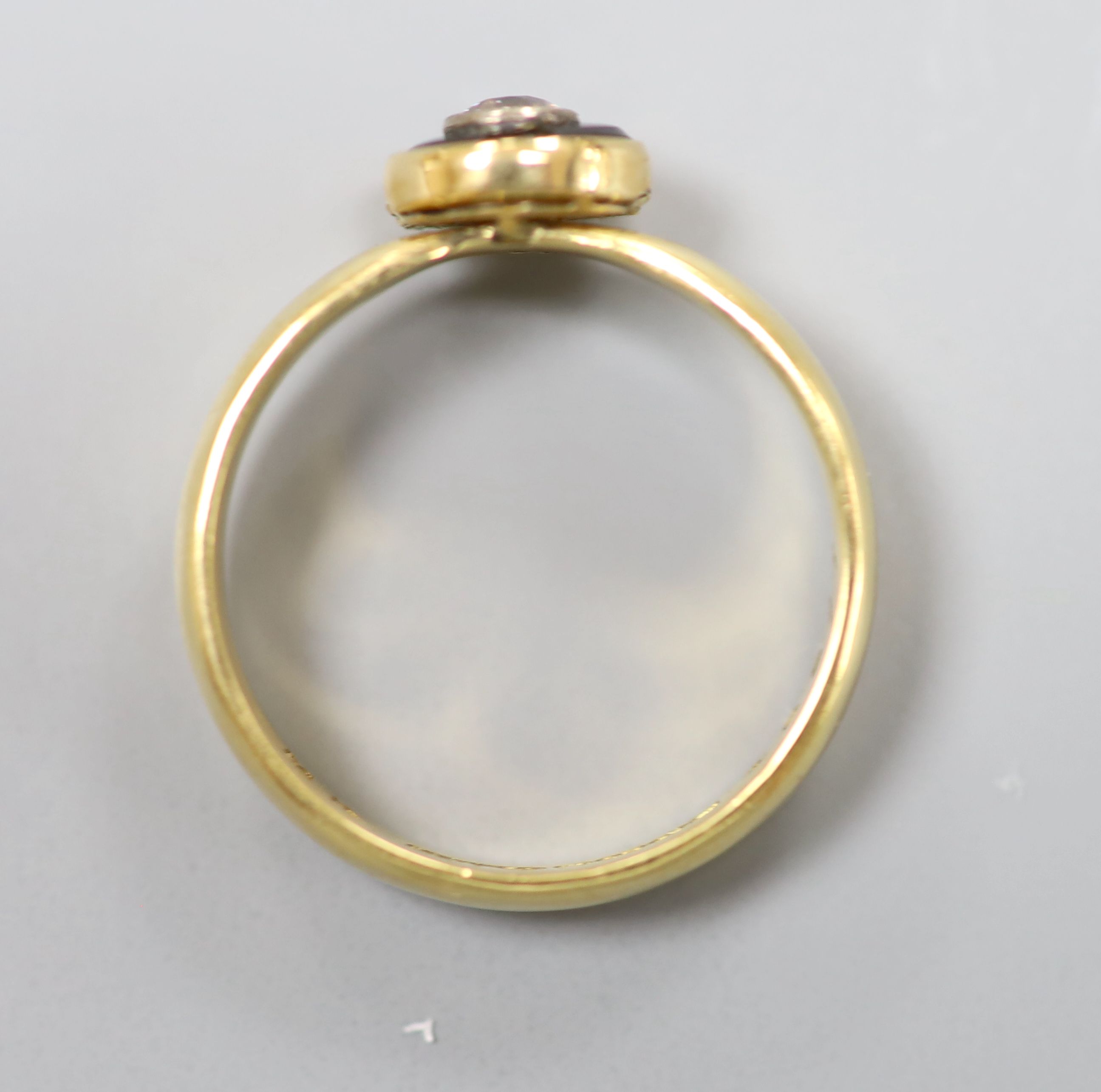 A modern 19th century style 18ct gold, black onyx and diamond set target ring